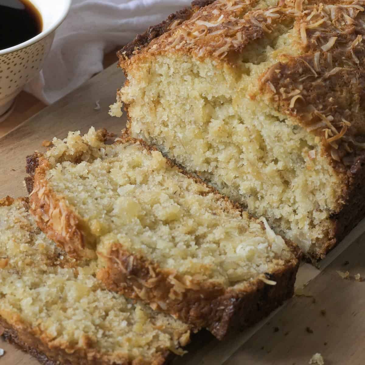 Moist Hawaiian banana bread topped with toasted coconut.