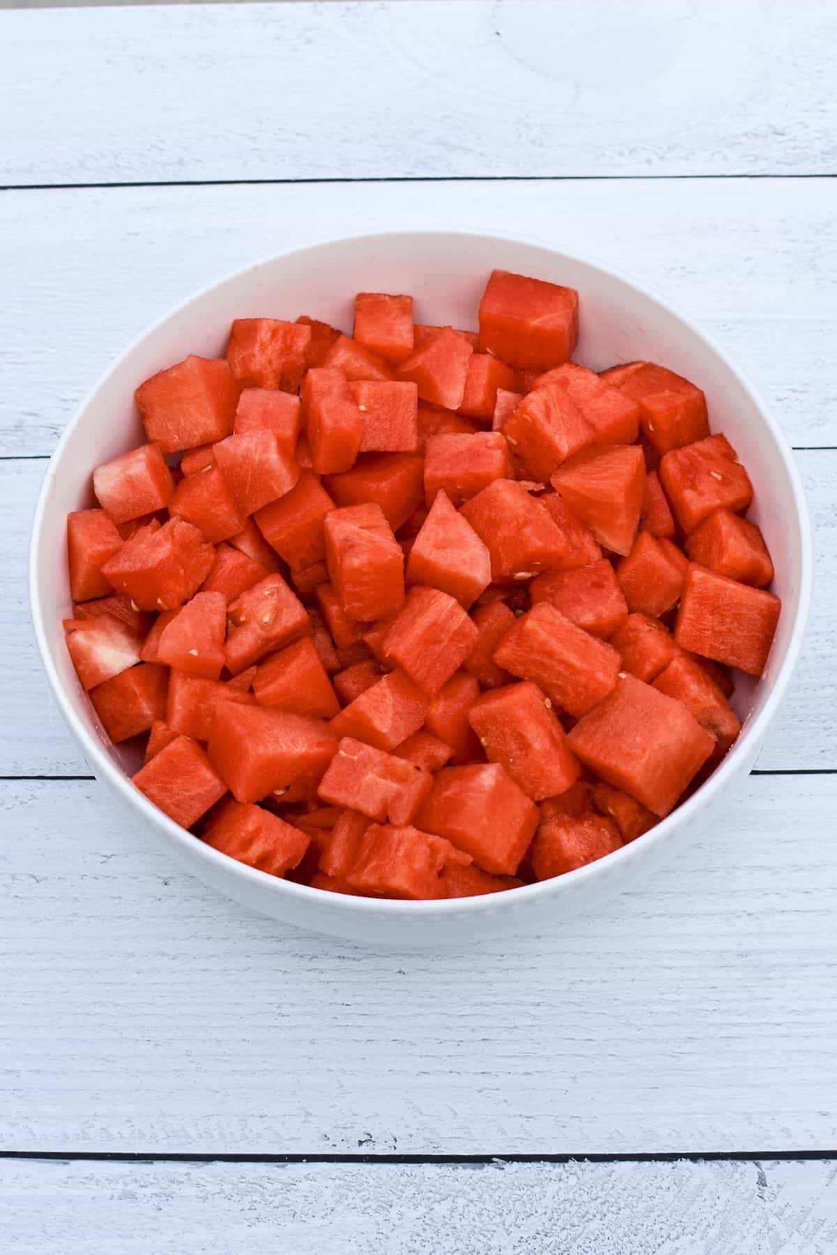 Cubed watermelon in serving bowl.