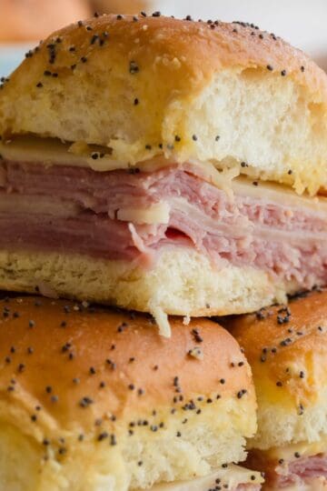 Ham and cheese sliders recipe made with Hawaiian rolls, ham, Swiss cheese, and buttery Dijon topping.