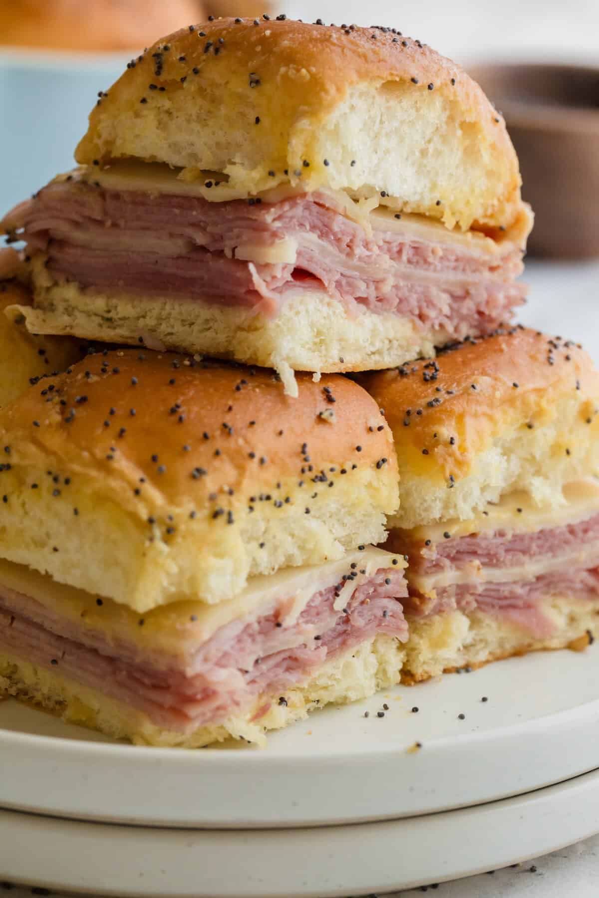 Ham and cheese sliders on Hawaiian rolls with Swiss cheese and deli ham.