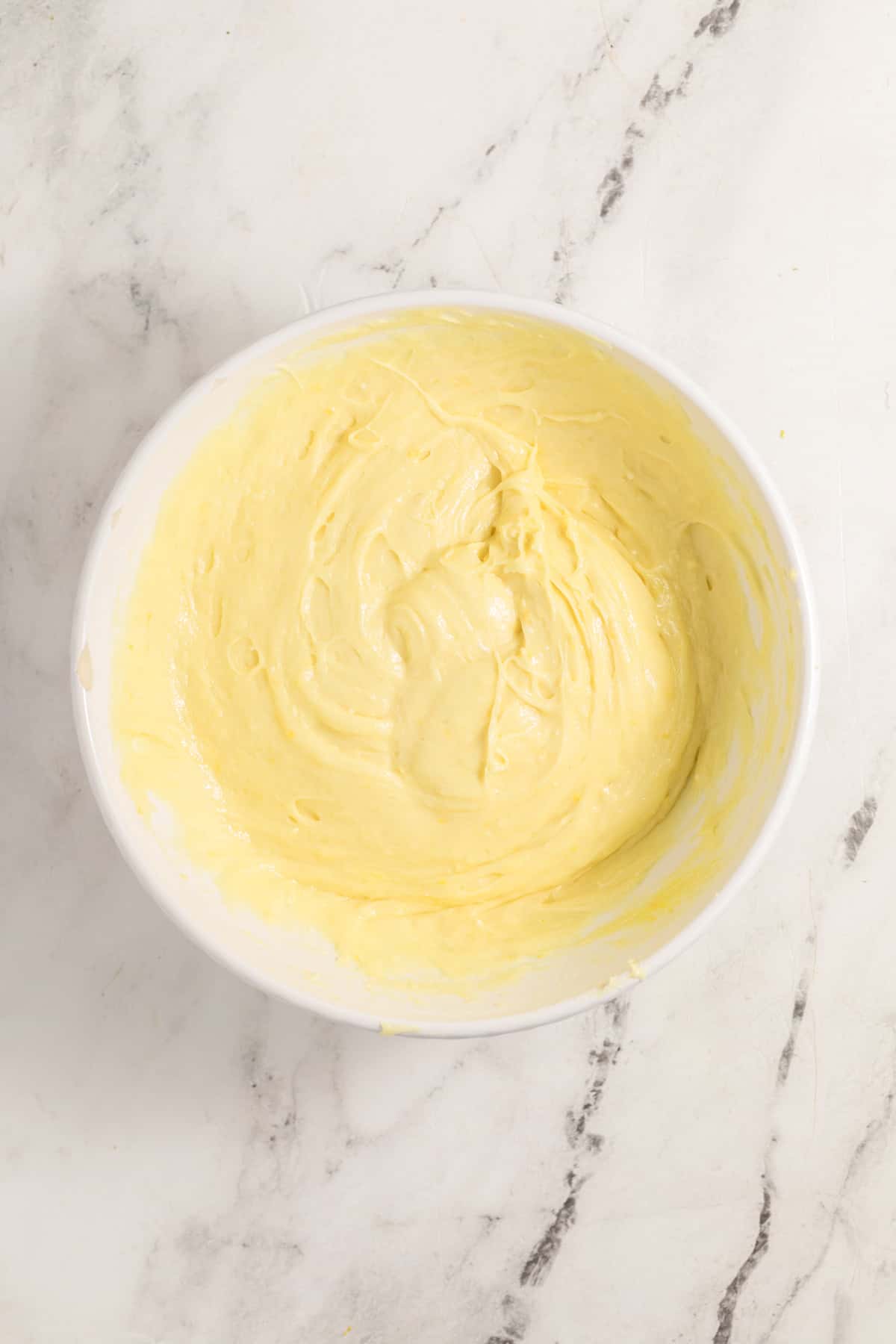 Lemon cake batter mixed until smooth and fluffy.