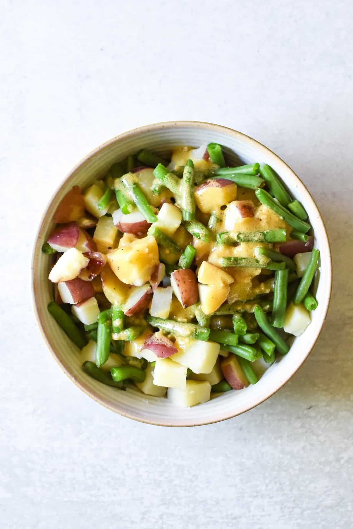 Warm potatoes and green beans tossed with a tangy vinaigrette. 