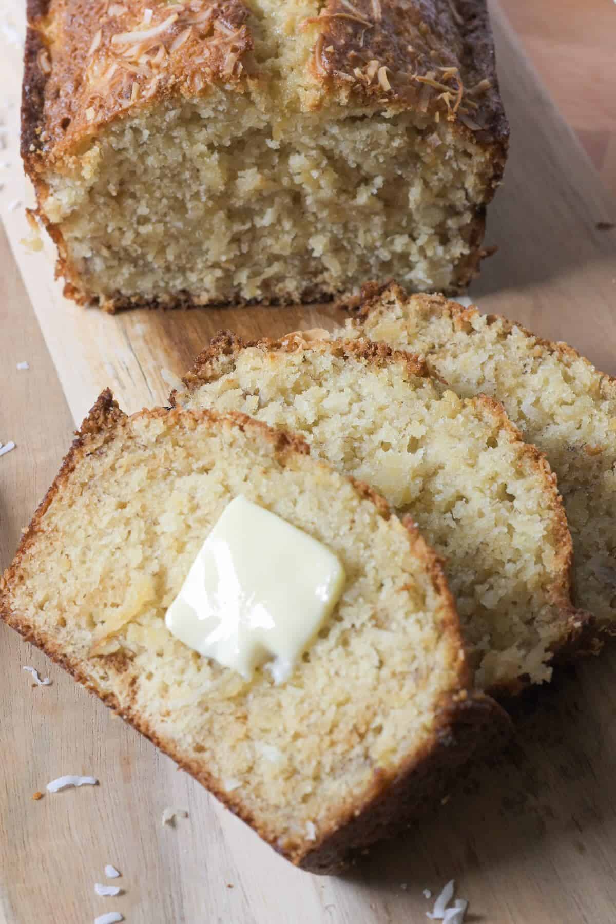 Slice of Hawaiian banana bread with melted butter.