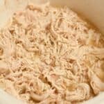 Tender slow cooker shredded chicken made with chicken breasts and simple seasonings.