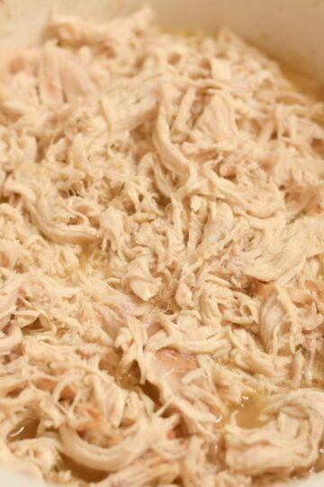 Tender slow cooker shredded chicken made with chicken breasts and simple seasonings.