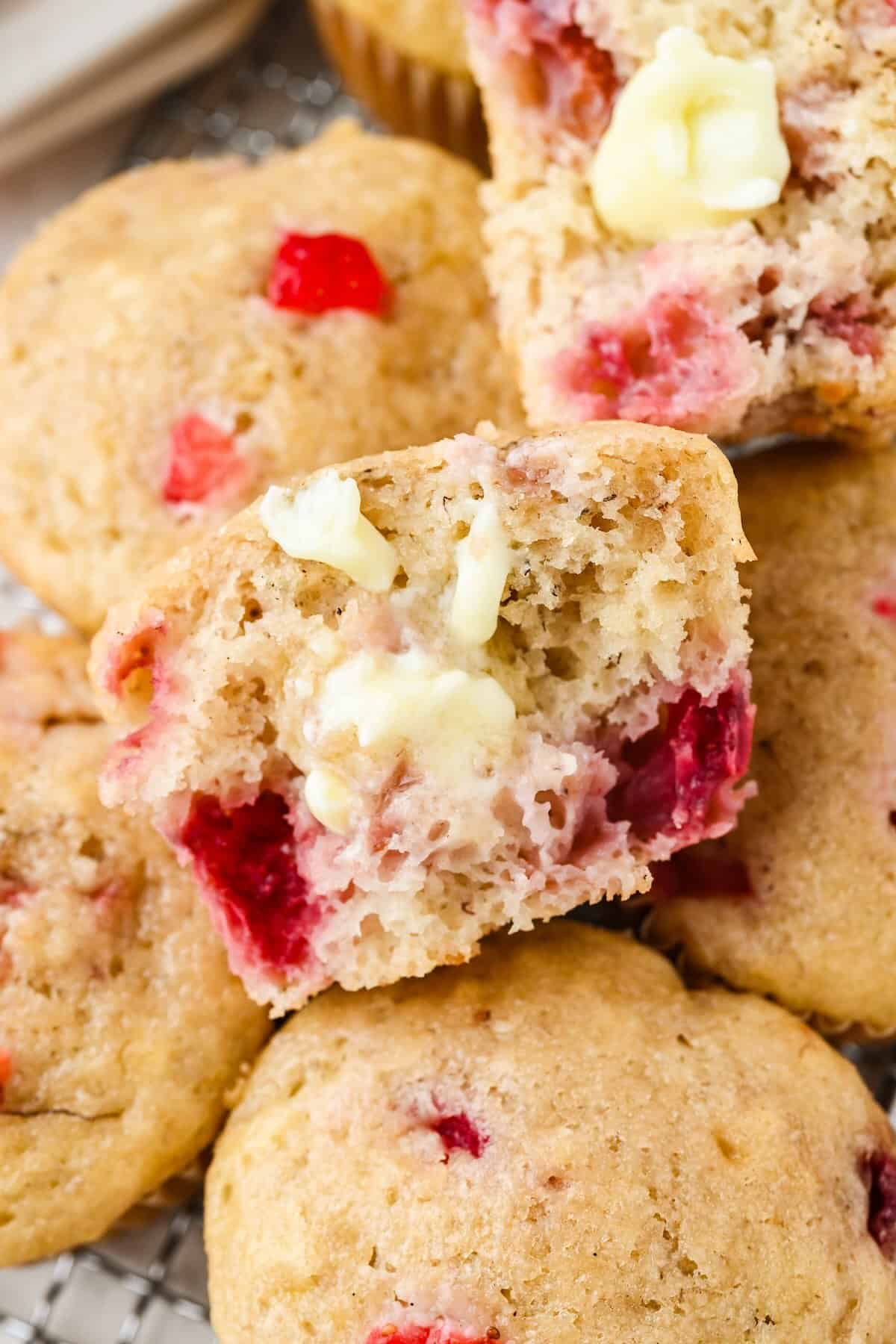 Warm strawberry banana muffin served with butter.