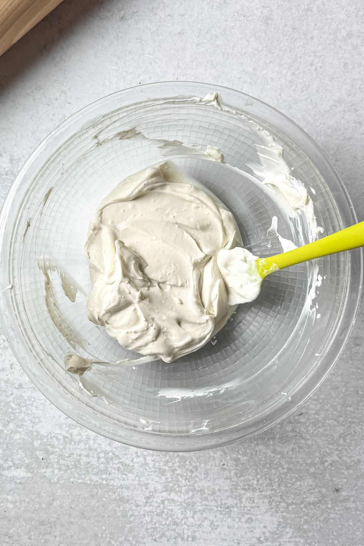 Cheesecake filling to layer over graham cracker crumbs in a dessert glass.