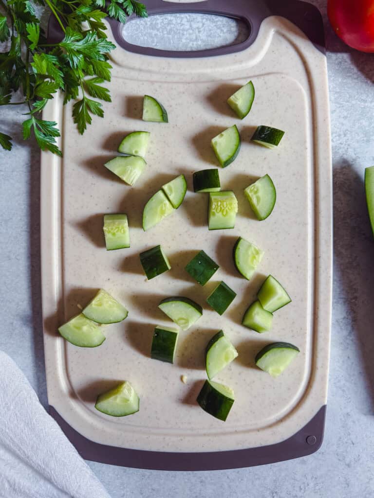 Chopped cucumber for cucumber tomato salad.