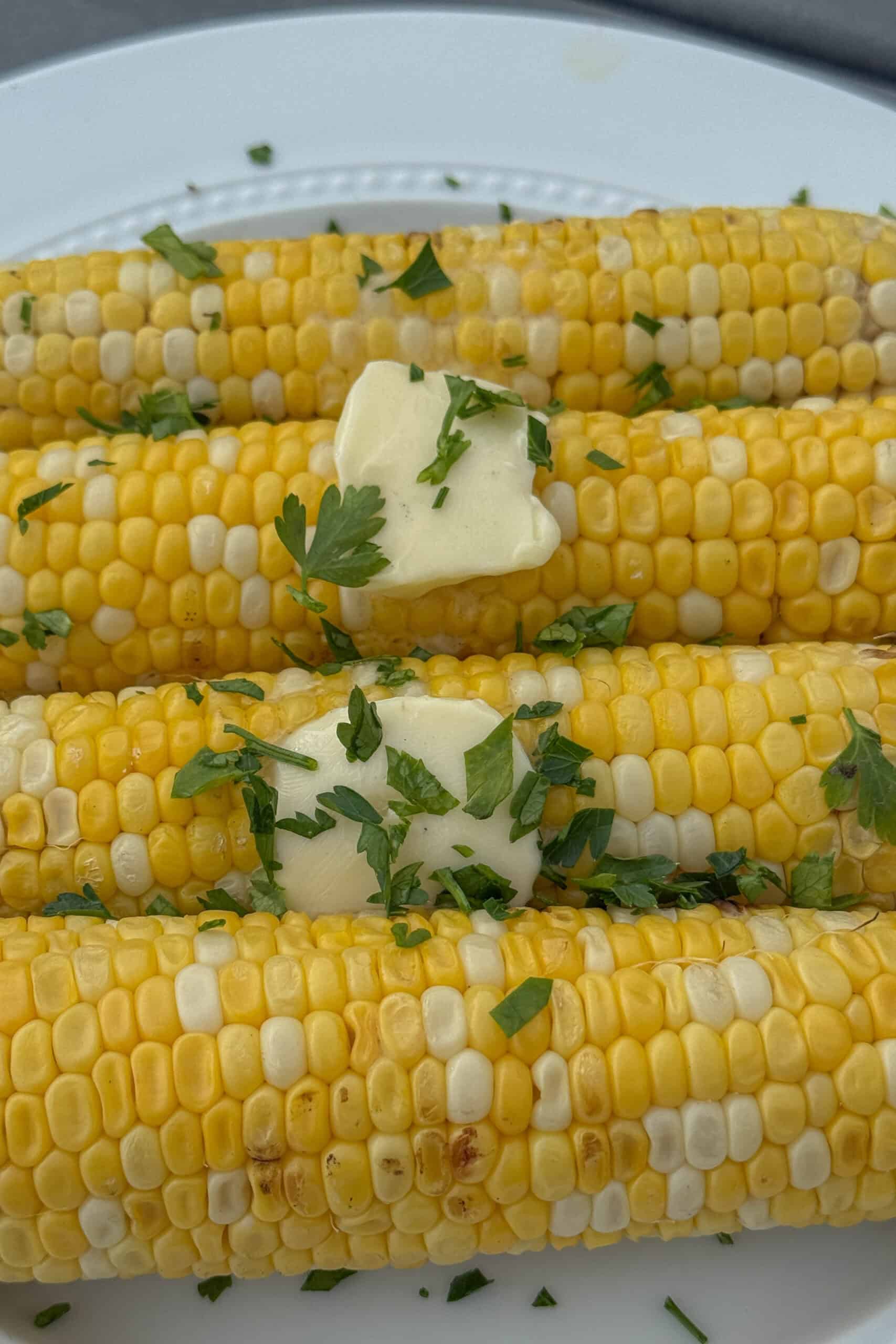 Close-up of grilled sweet corn with lightly charred kernels.