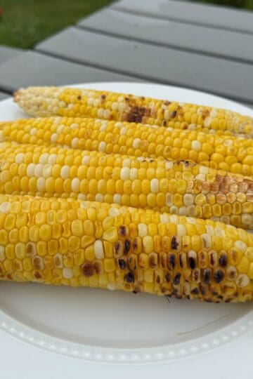 Close-up of grilled sweet corn with lightly charred kernels.