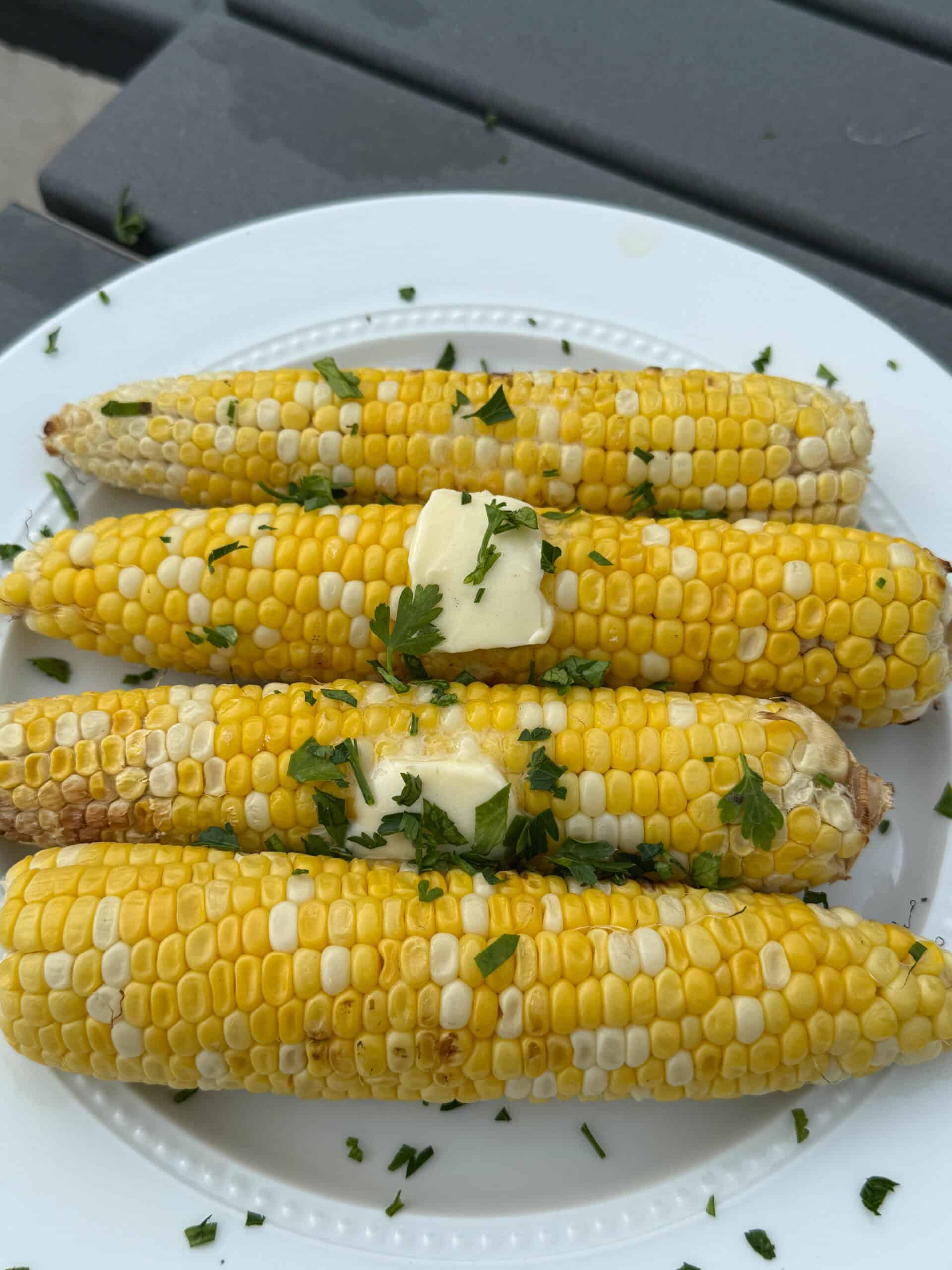 Platter of grilled sweet corn ready for a summer cookout.