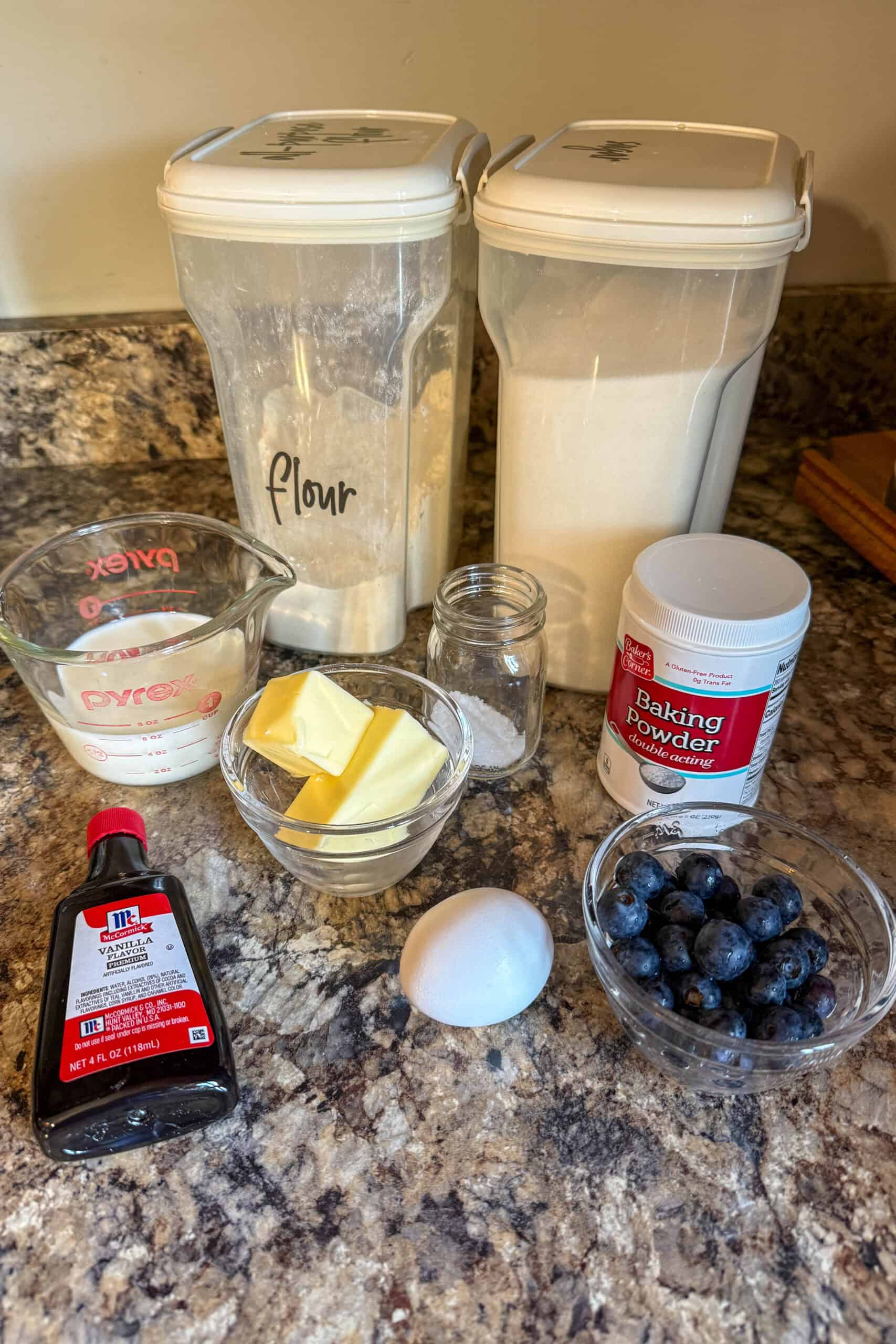 Ingredients needed to make homemade mini blueberry muffins.