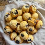 Easy homemade mini blueberry muffins served in a basket.