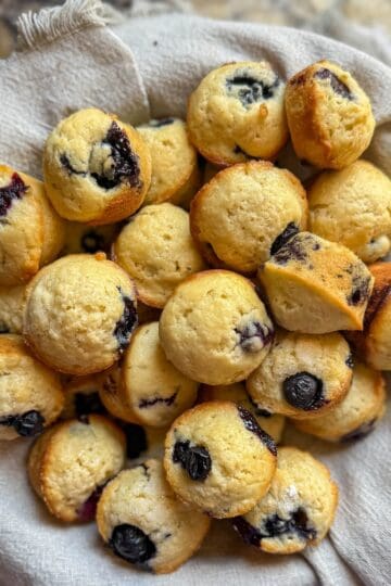 Easy homemade mini blueberry muffins served in a basket.