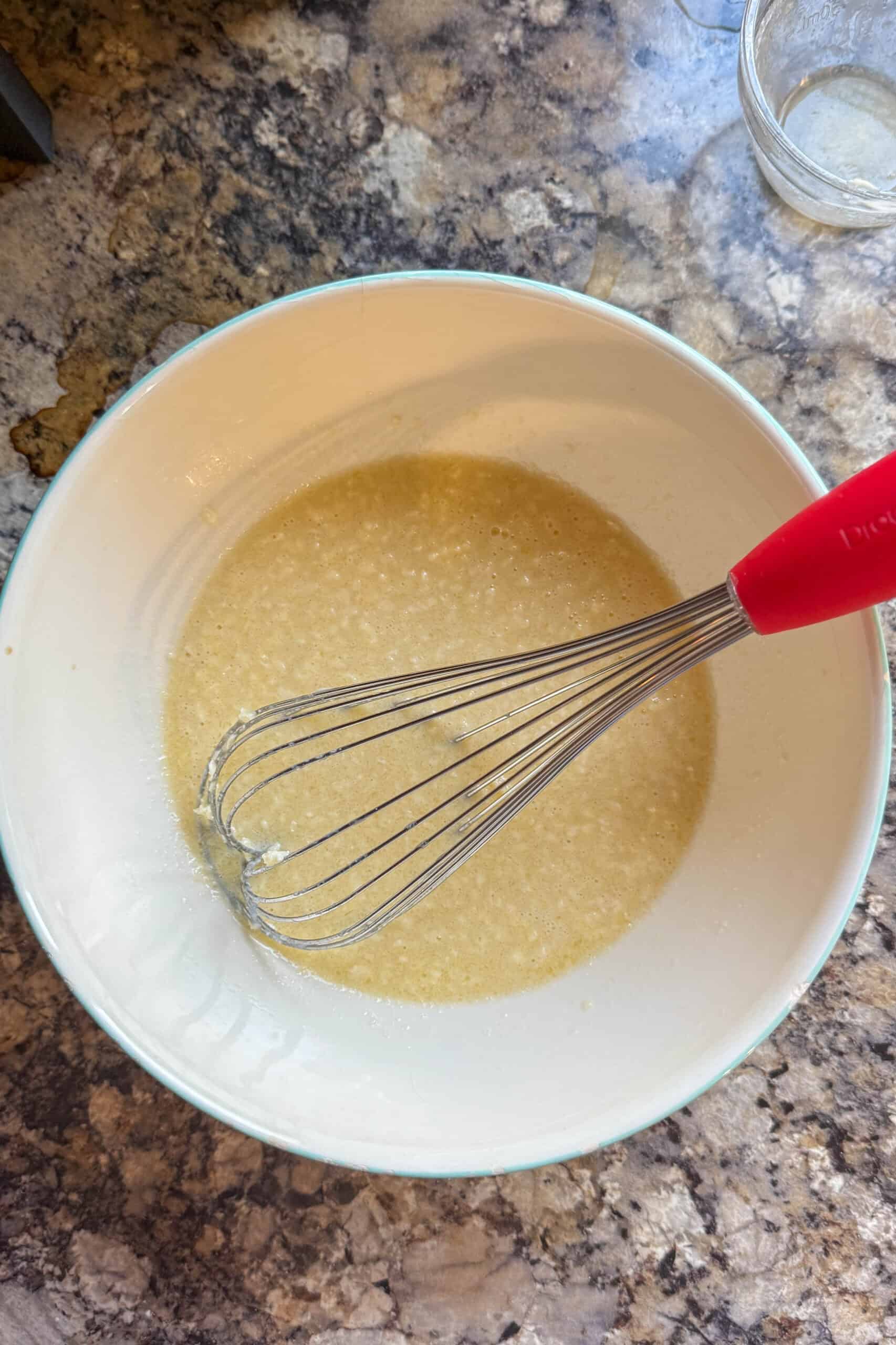 Wet ingredients whisked together before making blueberry muffin batter.
