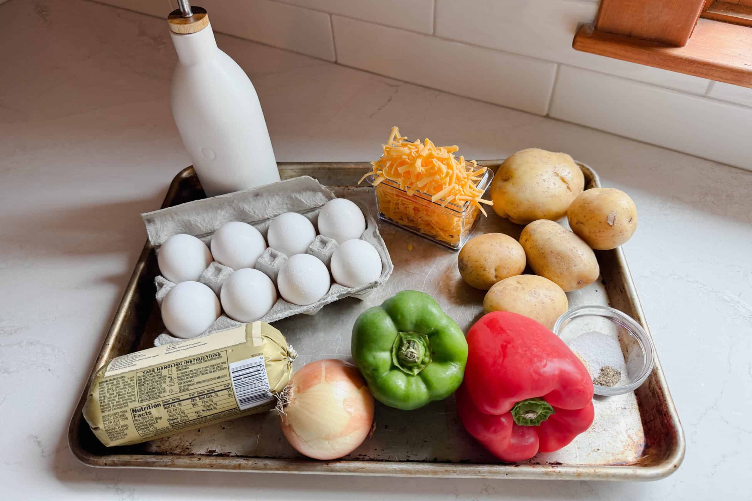 Eggs, sausage, potatoes and veggies to make a batch of breakfast bowls.