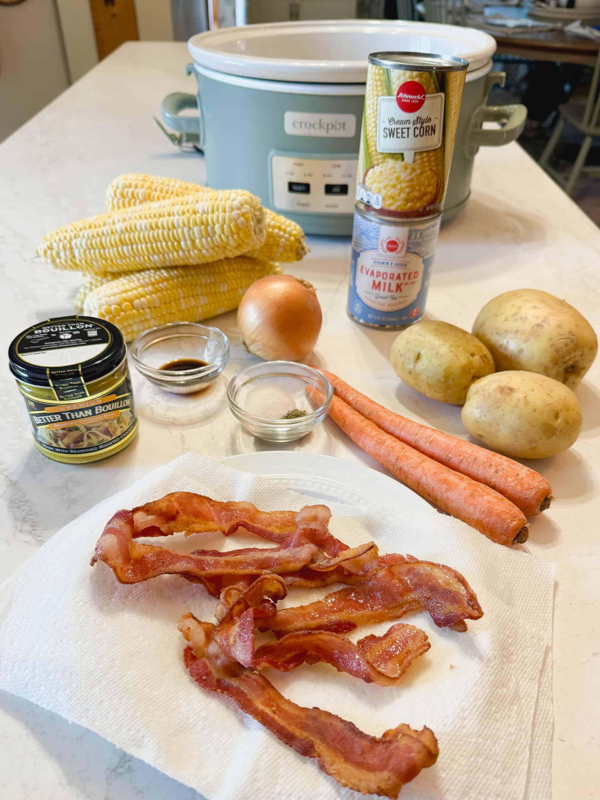 Ingredients to make a creamy corn chowder with bacon in the slow cooker.